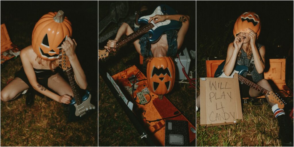 Girl wearing a pumpkin head with a guitar.